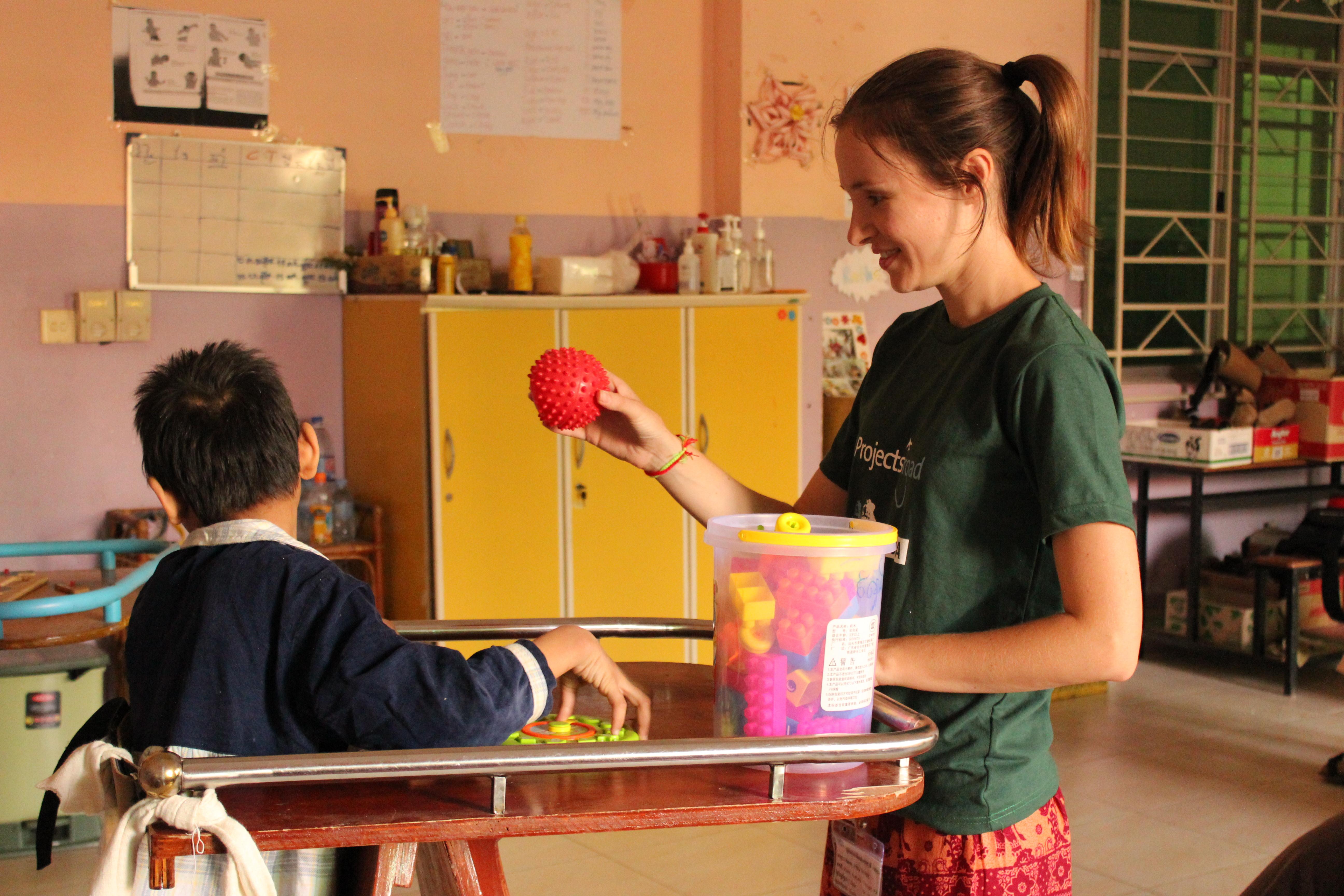 A female Projects Abroad intern is playing and engaging with a local child during her occupational therapy internship in Cambodia. An occupational therapy internship student in Cambodia is pictured playing and engaging with a young child during her work experience with Projects Abroad.